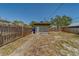 Backyard featuring a small shed, fence, and a concrete walkway at 2835 Dartmouth N Ave, St Petersburg, FL 33713