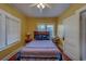 Serene bedroom with hardwood floors, a cozy bed, and natural light at 2835 Dartmouth N Ave, St Petersburg, FL 33713