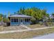 Charming home featuring a screened-in porch and landscaped front yard, offering curb appeal at 2835 Dartmouth N Ave, St Petersburg, FL 33713