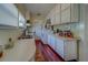 Efficient kitchen featuring ample white cabinetry and laminate countertops at 2835 Dartmouth N Ave, St Petersburg, FL 33713