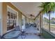 Inviting front porch with comfortable seating and a ceiling fan for enjoying outdoor living at 2835 Dartmouth N Ave, St Petersburg, FL 33713