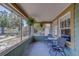 Relaxing screened porch with outdoor seating and serene views of the surrounding landscape at 2835 Dartmouth N Ave, St Petersburg, FL 33713