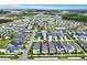 Aerial view of a modern residential neighborhood with well-maintained homes and community amenities at 28680 Cozy Creek Dr, Wesley Chapel, FL 33543