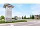 Community entrance sign for Persimmon Park at Wiregrass Ranch with stone base and landscaped area at 28680 Cozy Creek Dr, Wesley Chapel, FL 33543