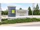 A detailed image of the Persimmon Park at Wiregrass Ranch community sign with landscaping around the sign at 28680 Cozy Creek Dr, Wesley Chapel, FL 33543