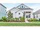 Charming one-story home showcasing a landscaped front yard and welcoming entrance at 28680 Cozy Creek Dr, Wesley Chapel, FL 33543