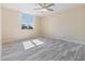 Light-filled bedroom featuring light walls, tiled flooring, and a window at 2901 26Th W St # 317, Bradenton, FL 34205