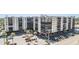 Multi-story condo building with on-site parking and mature trees on a sunny day at 2901 26Th W St # 317, Bradenton, FL 34205
