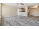Spacious living area with ceiling fan, light walls, and tile floors flowing to the kitchen at 2901 26Th W St # 317, Bradenton, FL 34205
