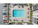 Aerial view of the community pool with lounge chairs, tables, and landscaping at 2901 26Th W St # 317, Bradenton, FL 34205