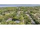 Scenic aerial view of lush, tree-lined neighborhood with homes, offering privacy and a tranquil setting at 34 Hickory Ln, Safety Harbor, FL 34695