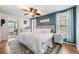 Comfortable bedroom with natural light, ceiling fan, and wood floors provides a peaceful resting space at 34 Hickory Ln, Safety Harbor, FL 34695