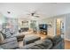 Inviting living room features a cozy fireplace, neutral decor, and plenty of natural light at 34 Hickory Ln, Safety Harbor, FL 34695