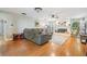 Open living room boasts hardwood floors, a fireplace, and stylish furnishings, perfect for entertaining at 34 Hickory Ln, Safety Harbor, FL 34695