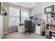 Functional home office with natural light, carpet flooring, and ample desk space for productivity at 34 Hickory Ln, Safety Harbor, FL 34695