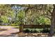Entrance to Philippe Park with stone sign, trees, and a paved road at 34 Hickory Ln, Safety Harbor, FL 34695