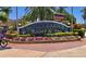 Entrance sign for the Safety Harbor Resort & Spa, surrounded by colorful flowers and palm trees at 34 Hickory Ln, Safety Harbor, FL 34695