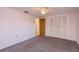 A cozy bedroom features a ceiling fan and a closet with bi-fold doors at 3706 Cambridge St, New Port Richey, FL 34652