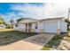 Charming one-story home with a well-maintained lawn, inviting front porch, and a single-car garage at 3706 Cambridge St, New Port Richey, FL 34652
