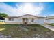 Cozy single-Gathering home with a well-lit front porch, single car garage, and mature tree providing shade at 3706 Cambridge St, New Port Richey, FL 34652