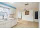 Charming kitchen features a double-basin sink, neutral countertops, and bright lighting, perfect for meal prep at 3706 Cambridge St, New Port Richey, FL 34652