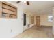 A living space with tiled flooring, a door to the exterior, and a cozy atmosphere at 3706 Cambridge St, New Port Richey, FL 34652