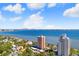 Aerial view showing buildings, the ocean, a city skyline, and the nearby homes at 4015 Bayshore Blvd # 8E, Tampa, FL 33611