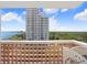 Balcony view showcasing a high-rise building, blue skies, and lush greenery at 4015 Bayshore Blvd # 8E, Tampa, FL 33611