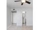 A brightly lit bedroom with a ceiling fan and views into the en-suite bathroom at 4015 Bayshore Blvd # 8E, Tampa, FL 33611