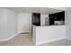A bright kitchen with white cabinets, stainless steel appliances, and eat-in counter at 4015 Bayshore Blvd # 8E, Tampa, FL 33611