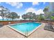 Outdoor swimming pool with lounge chairs and lush greenery at 4015 Bayshore Blvd # 8E, Tampa, FL 33611