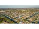 Wide aerial shot of a waterfront neighborhood featuring single-Gathering homes on deep water canals at 4644 Bay Crest Dr, Tampa, FL 33615