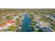 High-angle view of canal-front homes featuring private docks and backyard access to deep water at 4644 Bay Crest Dr, Tampa, FL 33615