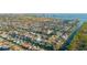 Aerial view of waterfront property featuring a canal, private boat dock, and beautiful neighborhood at 4644 Bay Crest Dr, Tampa, FL 33615