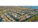 Overhead shot of a waterfront home with direct canal access and nearby community amenities at 4644 Bay Crest Dr, Tampa, FL 33615