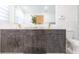 Modern bathroom vanity with gray wood cabinets, gold fixtures, and a decorative plant on the white countertop at 4644 Bay Crest Dr, Tampa, FL 33615