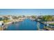 A picturesque canal scene features waterfront homes with private docks and outdoor entertaining spaces at 4644 Bay Crest Dr, Tampa, FL 33615