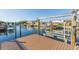 Well-maintained private dock featuring a boat lift and serene canal views at 4644 Bay Crest Dr, Tampa, FL 33615
