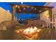 Relaxing outdoor area with covered seating and a firepit, ideal for evening gatherings at 4644 Bay Crest Dr, Tampa, FL 33615