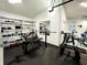 Spacious garage gym including weight bench, treadmill, squat rack, and shelving for equipment storage at 4644 Bay Crest Dr, Tampa, FL 33615