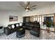 Open living area with unique tile flooring, sectional sofa, and access to other rooms at 4644 Bay Crest Dr, Tampa, FL 33615