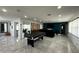 Expansive living room featuring sleek, polished floors, ample lighting, modern furnishings, and an open-concept design at 4644 Bay Crest Dr, Tampa, FL 33615