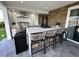 Well-equipped outdoor kitchen with a marble countertop island and grill, perfect for entertaining at 4644 Bay Crest Dr, Tampa, FL 33615