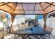 Covered patio with outdoor dining set, great for enjoying meals and outdoor living at 4644 Bay Crest Dr, Tampa, FL 33615