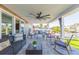 Spacious covered patio with comfortable seating, large fan, and water views, ideal for relaxing and entertaining at 4644 Bay Crest Dr, Tampa, FL 33615