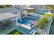 Stunning pool area with in-pool fountains, modern patio and outdoor seating with lush landscaping at 4644 Bay Crest Dr, Tampa, FL 33615