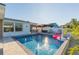 Backyard pool with sun shelf, fountain features, and an outdoor cabana for shaded relaxation at 4644 Bay Crest Dr, Tampa, FL 33615