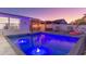Inviting pool area with gazebo, lounge chairs, flamingo float and ambient lighting creating a relaxing outdoor oasis at 4644 Bay Crest Dr, Tampa, FL 33615