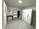 Well-organized walk-in closet with white shelving, and gray floors at 4644 Bay Crest Dr, Tampa, FL 33615