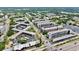 Overhead view of community buildings, road access, and covered parking amongst mature Florida landscaping at 5501 80Th N St # 509, St Petersburg, FL 33709